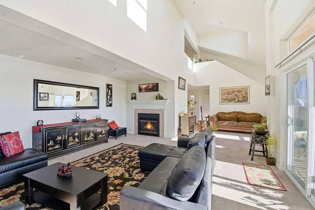 a kitchen with granite countertop cabinets stove top oven and microwave