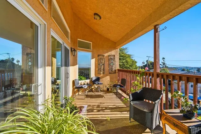 a view of balcony with chairs