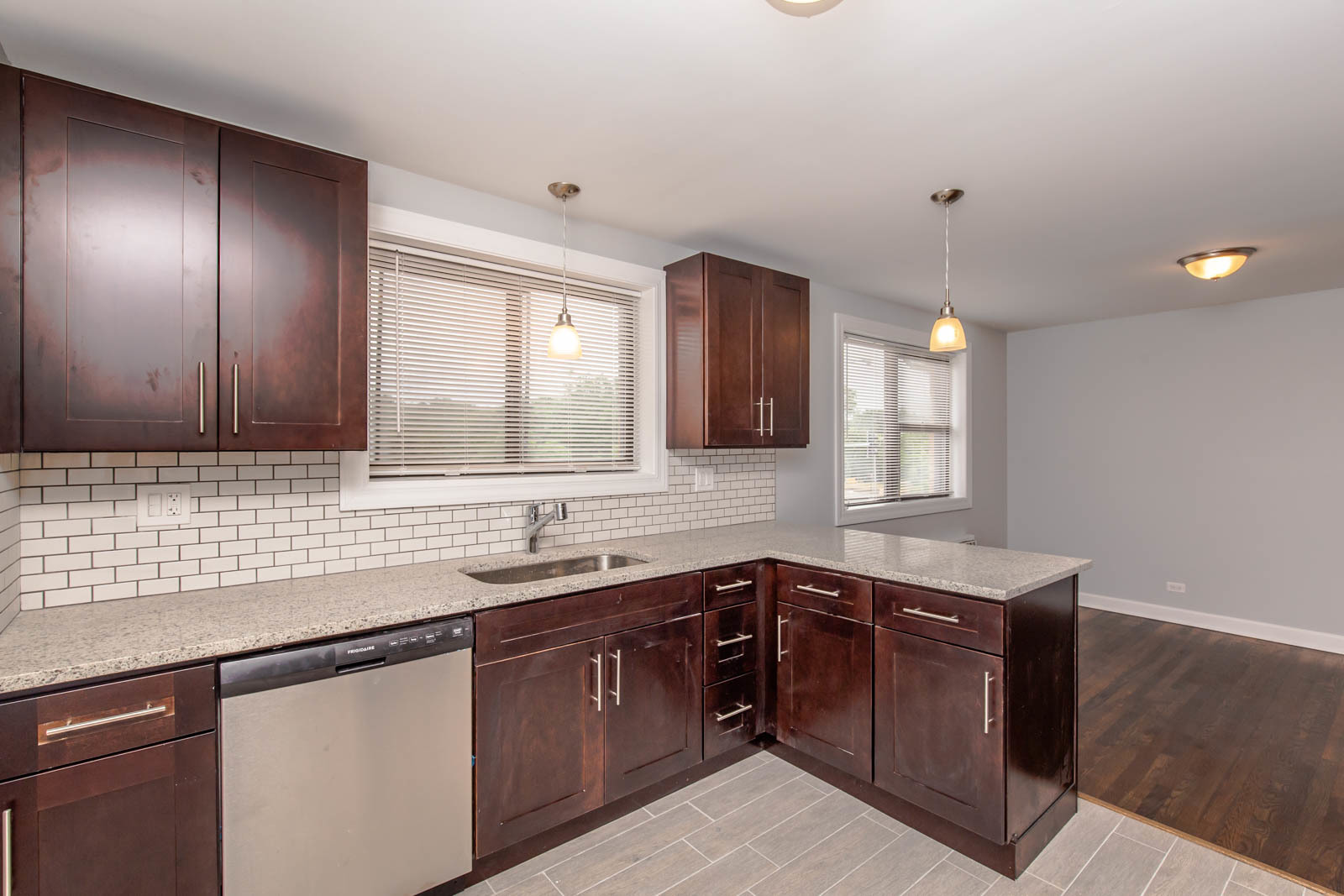 6805 North Ridge Boulevard, Unit 104 Chicago, IL 60645 - Photo 5 of 11 a kitchen with a sink and a window