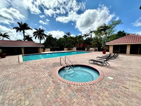a view of a swimming pool with a patio