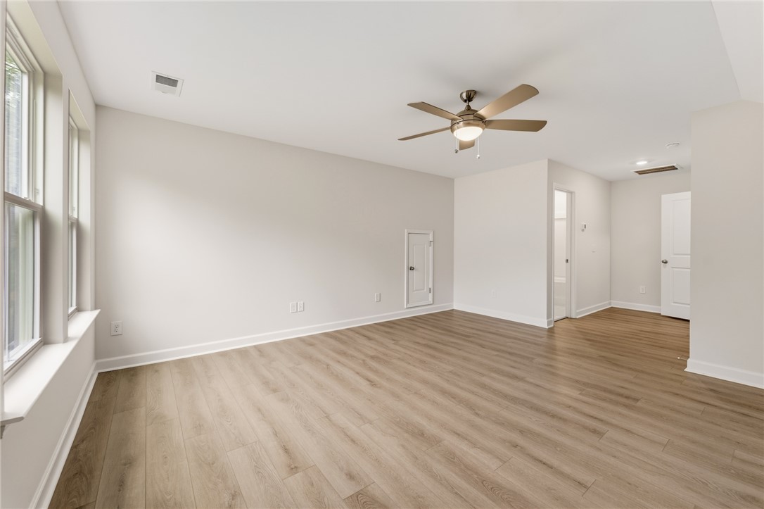 110 Lakeside Drive Anderson, SC 29621 - Photo 31 of 34 This versatile living space features durable flooring and ample natural light, perfect for any design vision.