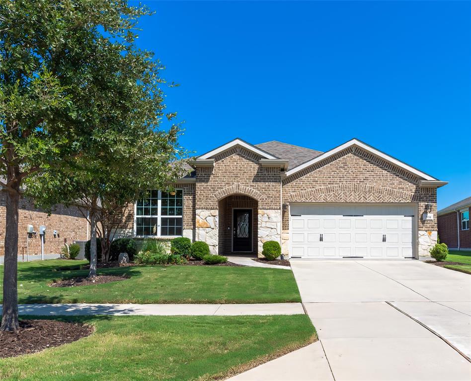2934 Rolling River Road Frisco, TX 75036 - Photo 1 of 1 a front view of a house with a yard and trees