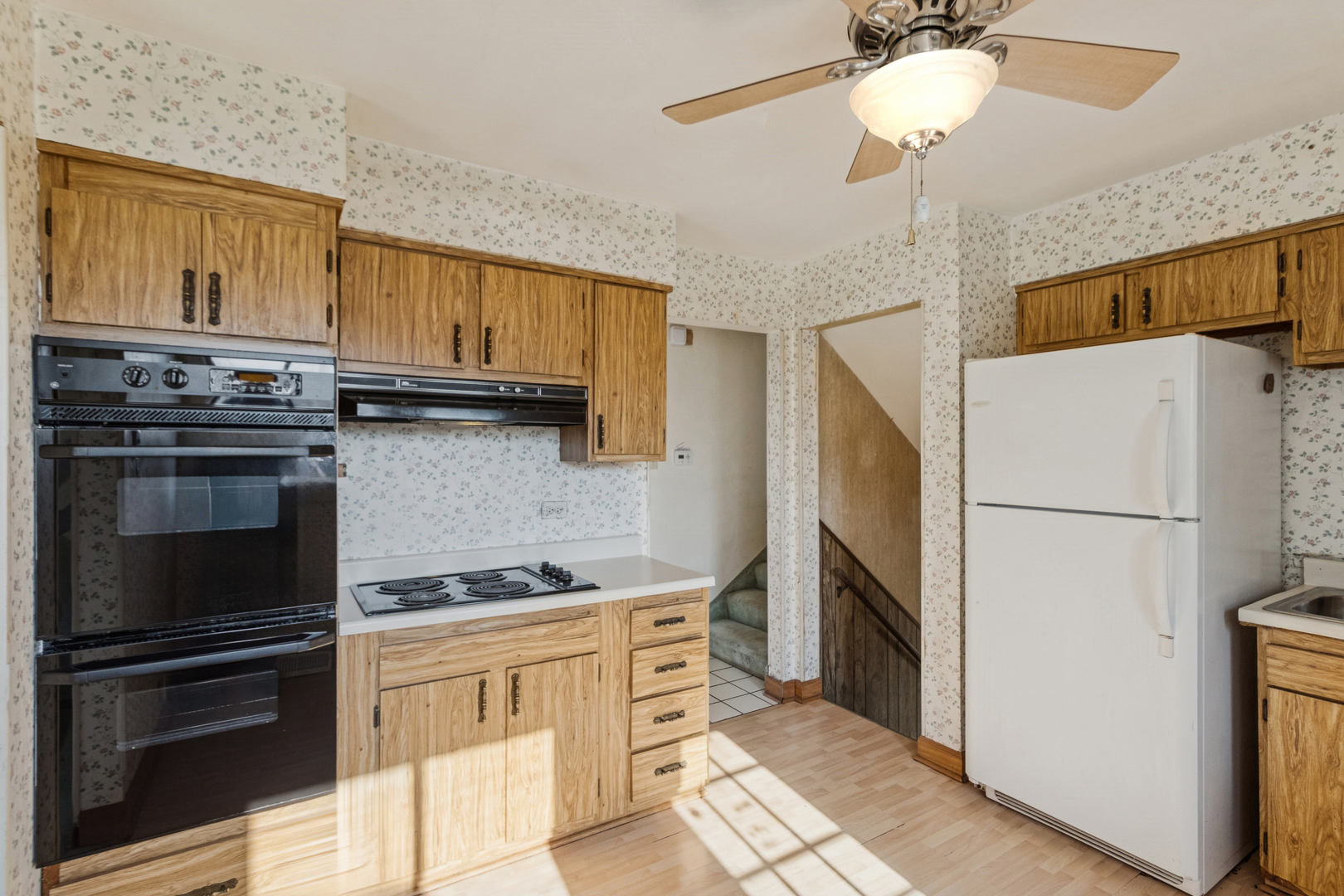 431 Ardmore Terrace Addison, IL 60101 - Photo 2 of 15 a kitchen with stainless steel appliances a refrigerator sink and stove