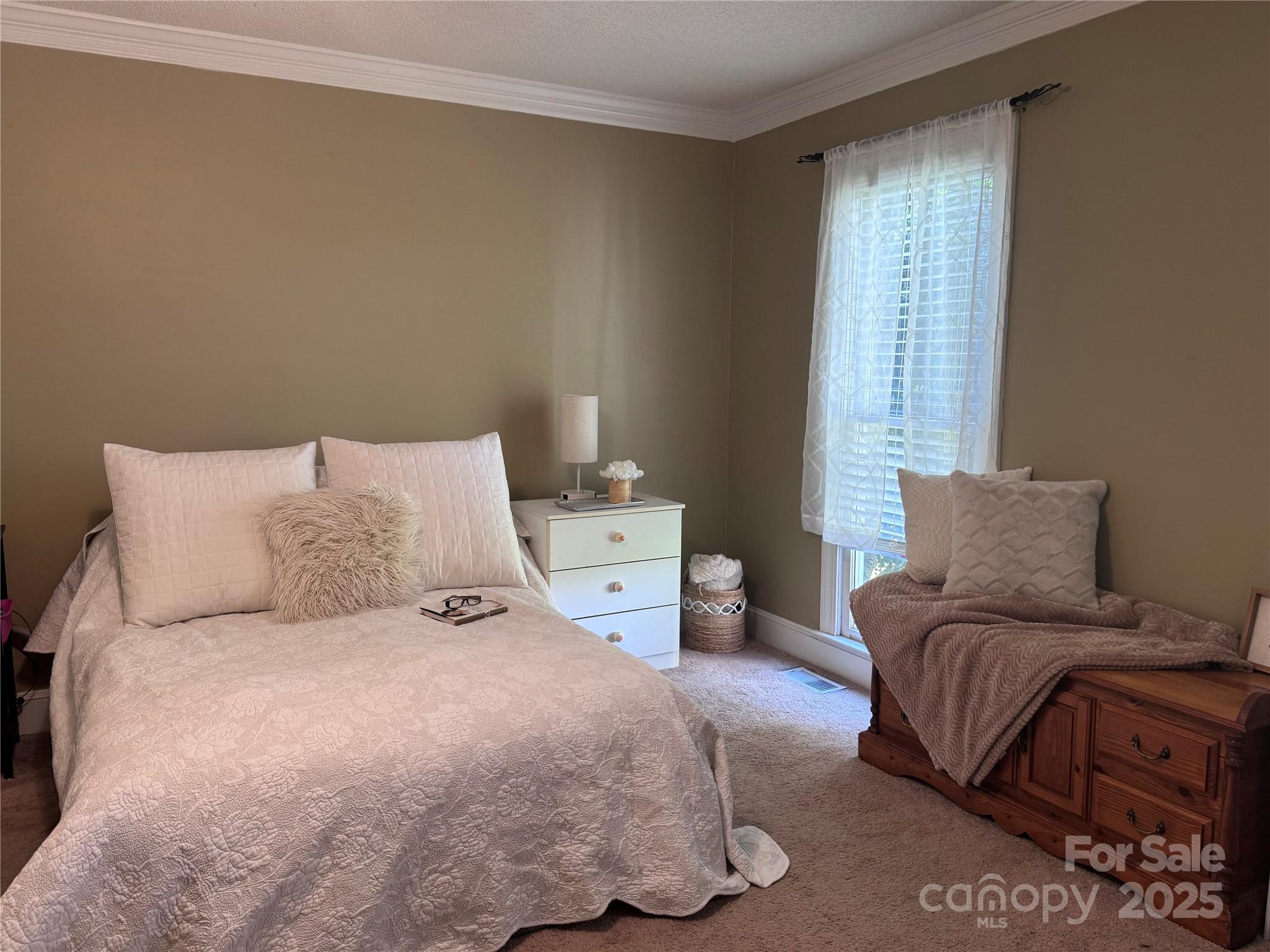 331 Polk Ford Road Stanfield, NC 28163 - Photo 11 of 33 a bedroom with a bed and window