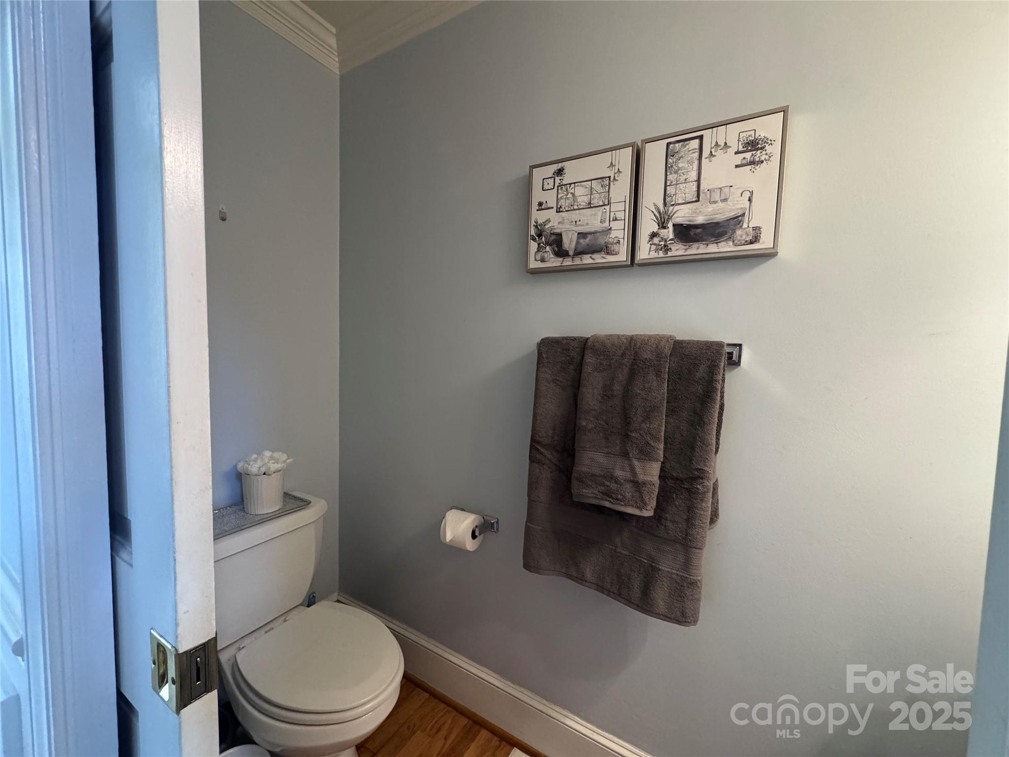 331 Polk Ford Road Stanfield, NC 28163 - Photo 13 of 33 a white toilet sitting next to a bathroom sink