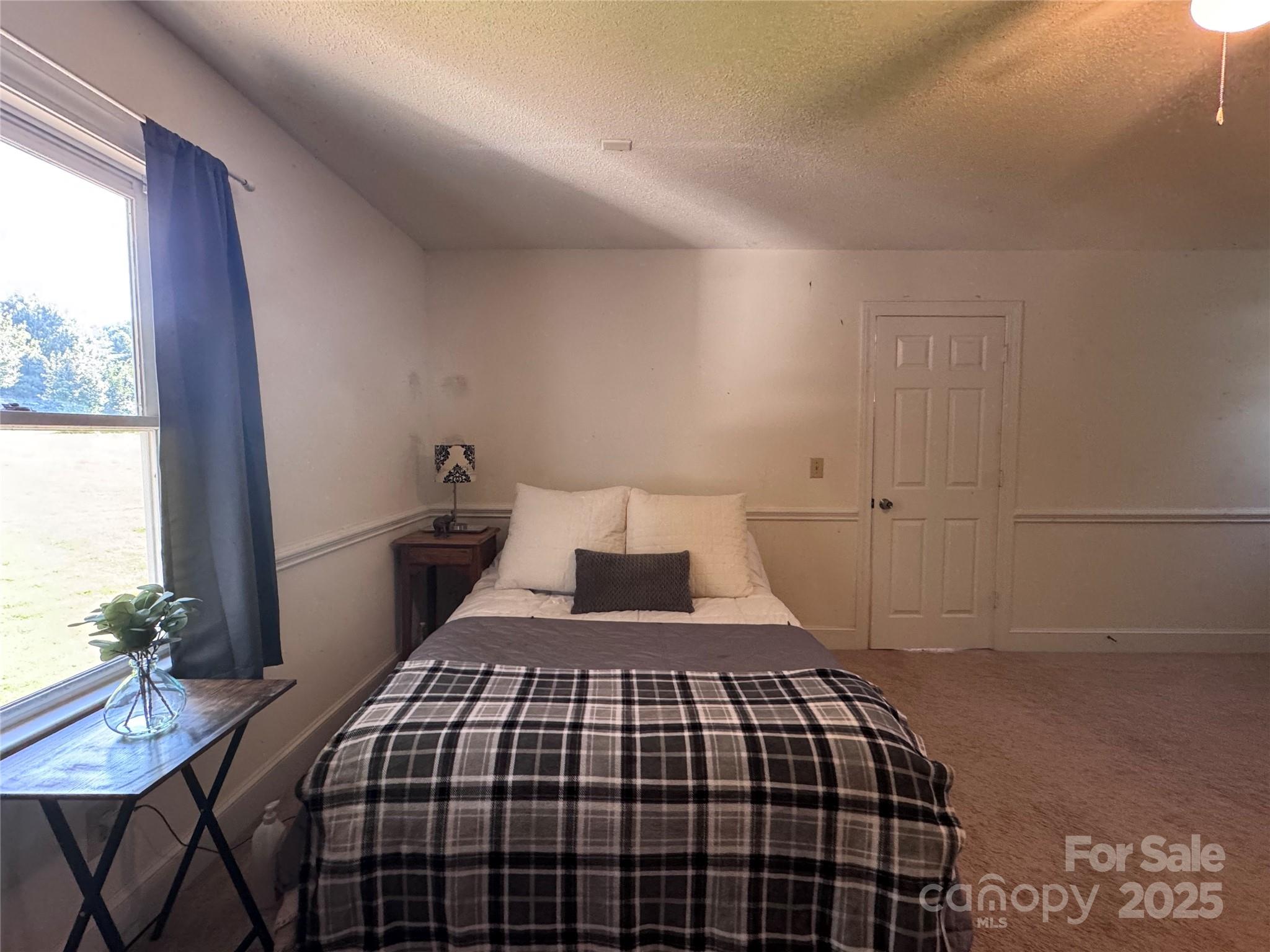 331 Polk Ford Road Stanfield, NC 28163 - Photo 18 of 33 a bedroom with a bed and a window