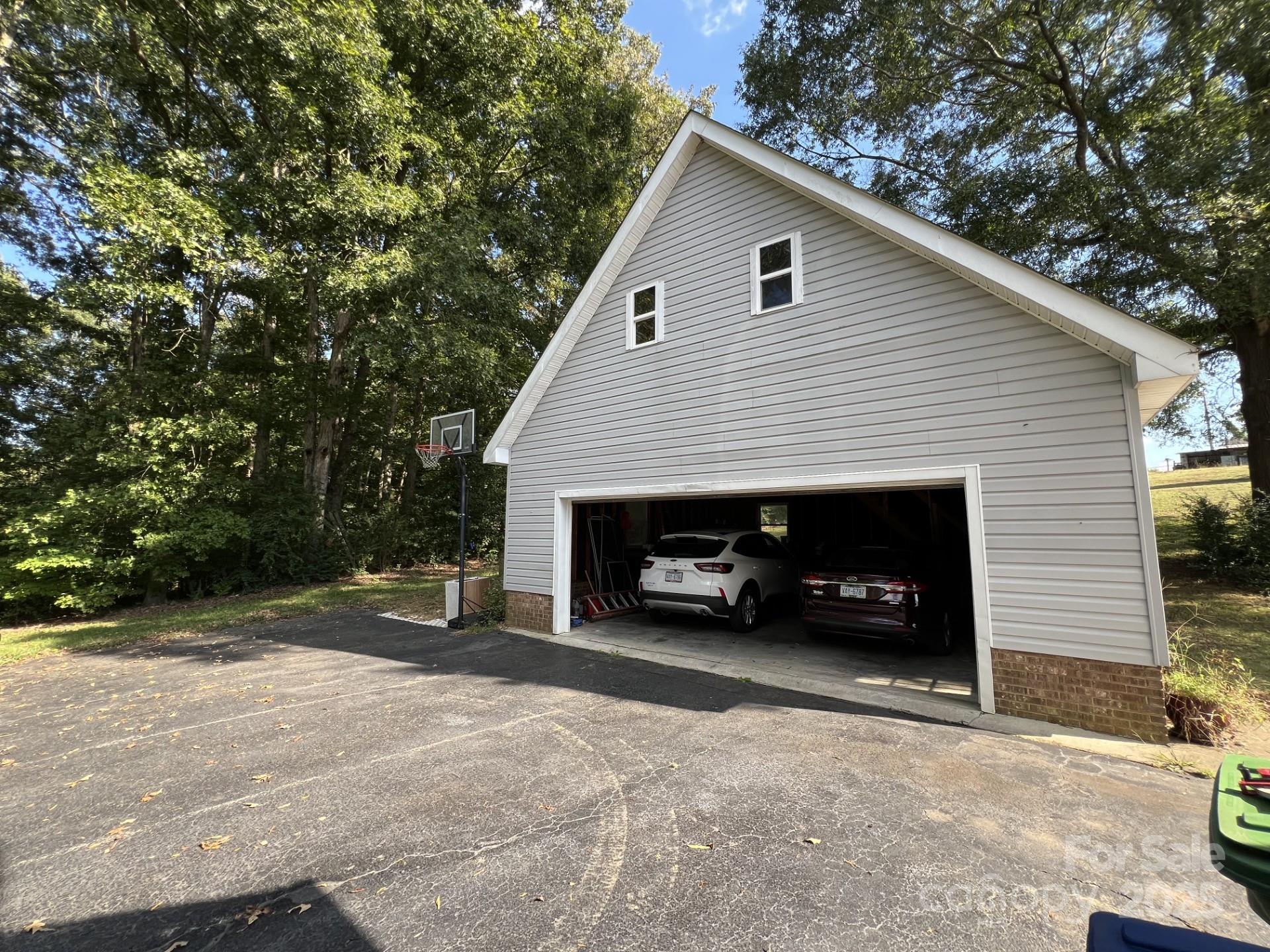 331 Polk Ford Road Stanfield, NC 28163 - Photo 25 of 33 a view of a house with a yard and garage
