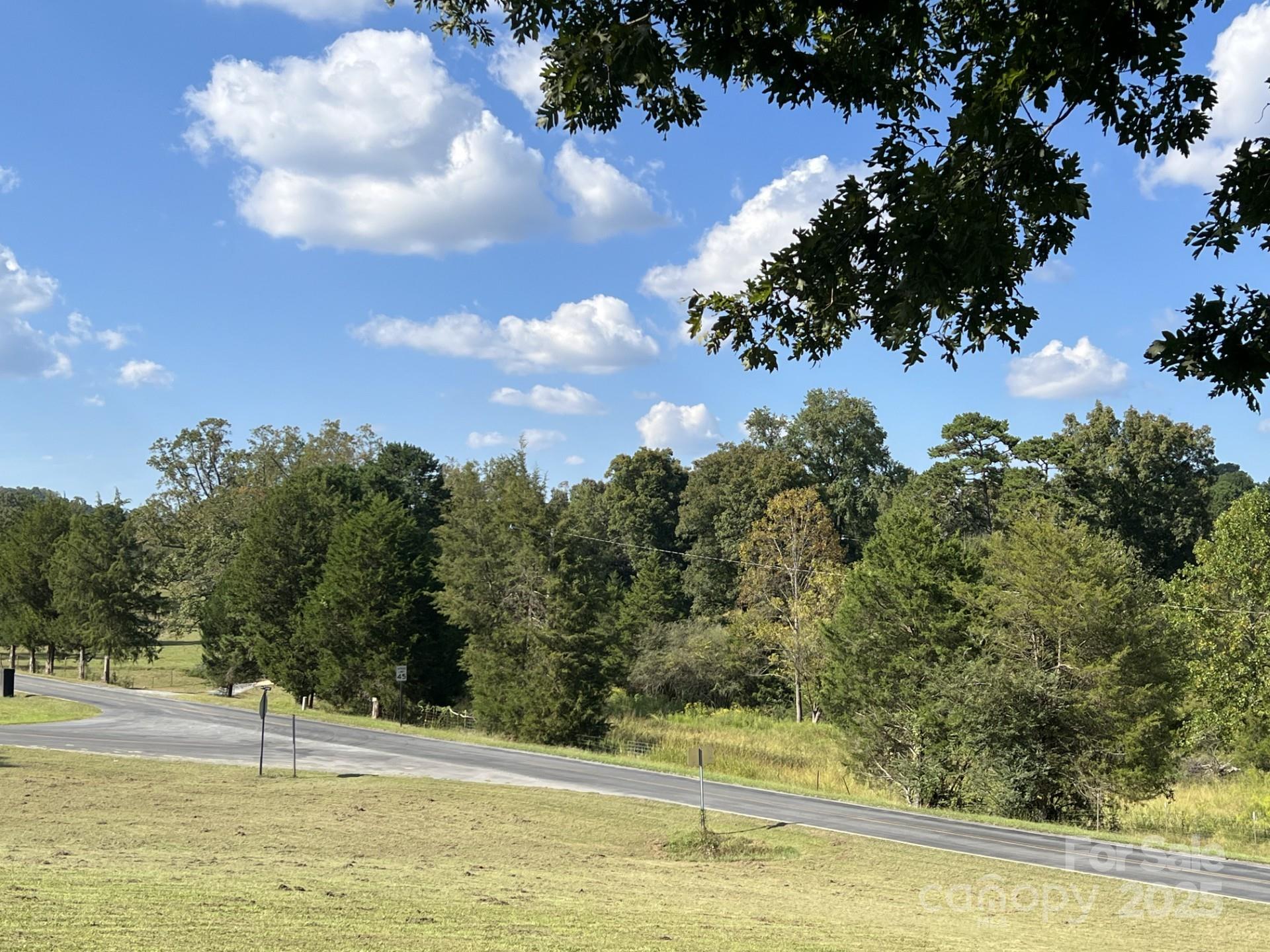 331 Polk Ford Road Stanfield, NC 28163 - Photo 28 of 33 a view of a swimming pool with an outdoor space and seating area