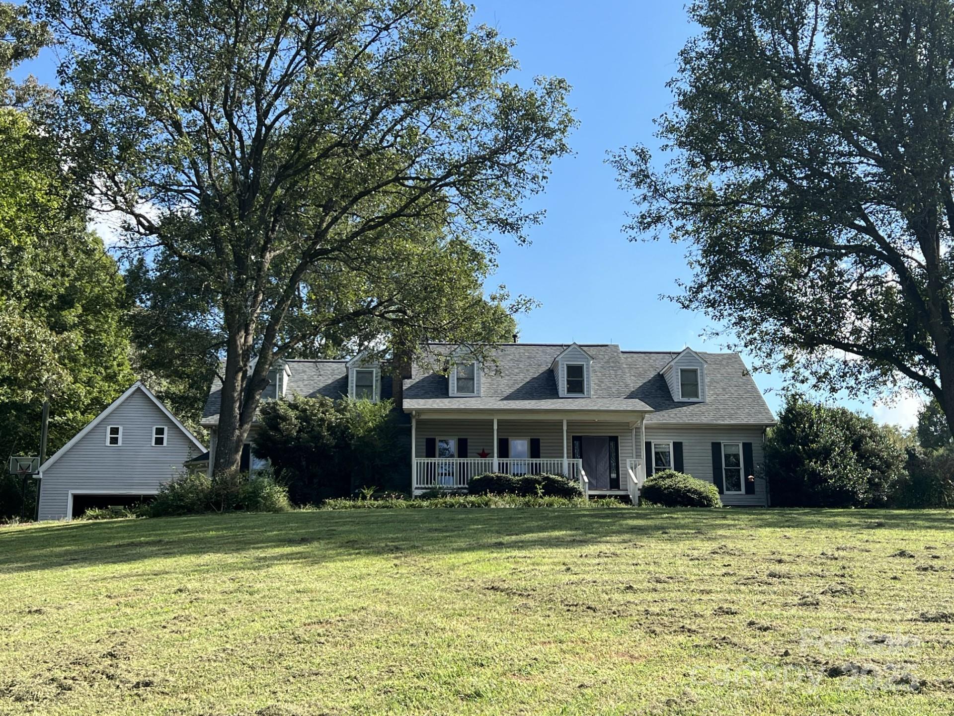 331 Polk Ford Road Stanfield, NC 28163 - Photo 29 of 33 a front view of a house with a garden
