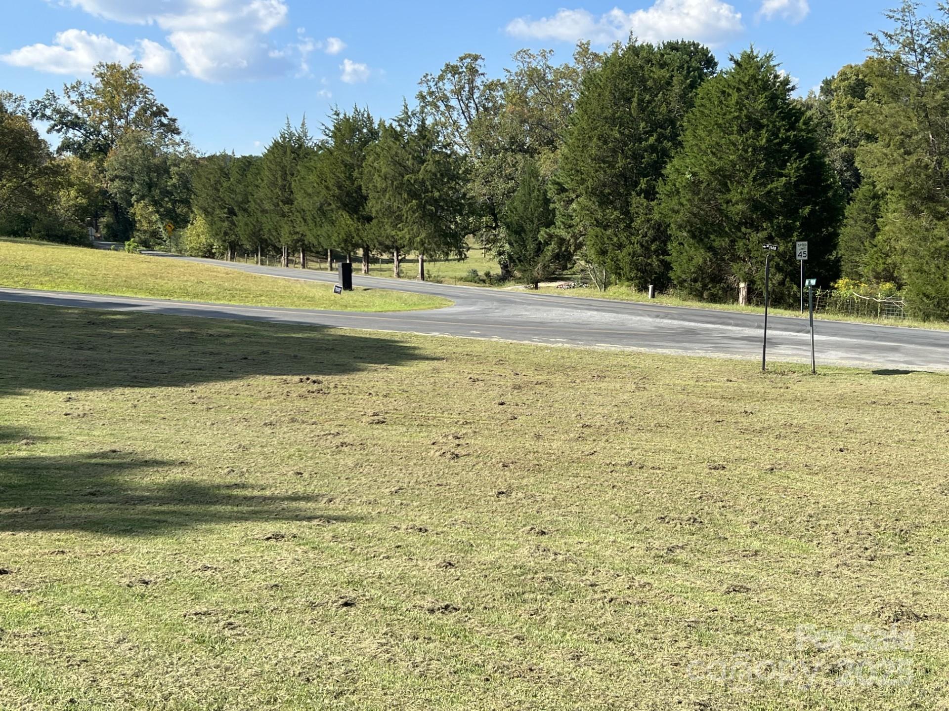 331 Polk Ford Road Stanfield, NC 28163 - Photo 30 of 33 a view of a pool with a yard