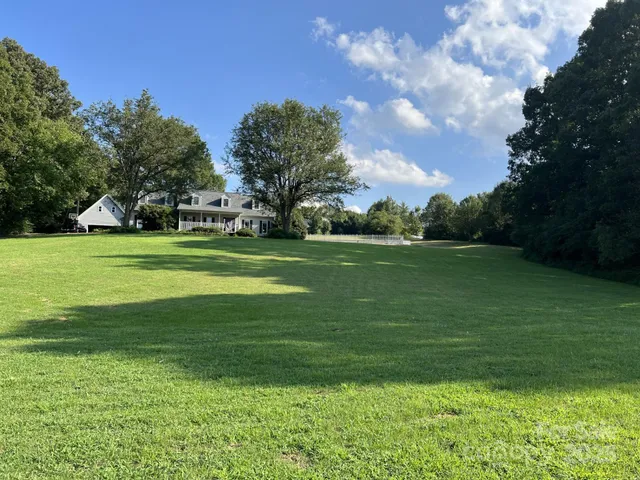 a view of a golf course with a lake