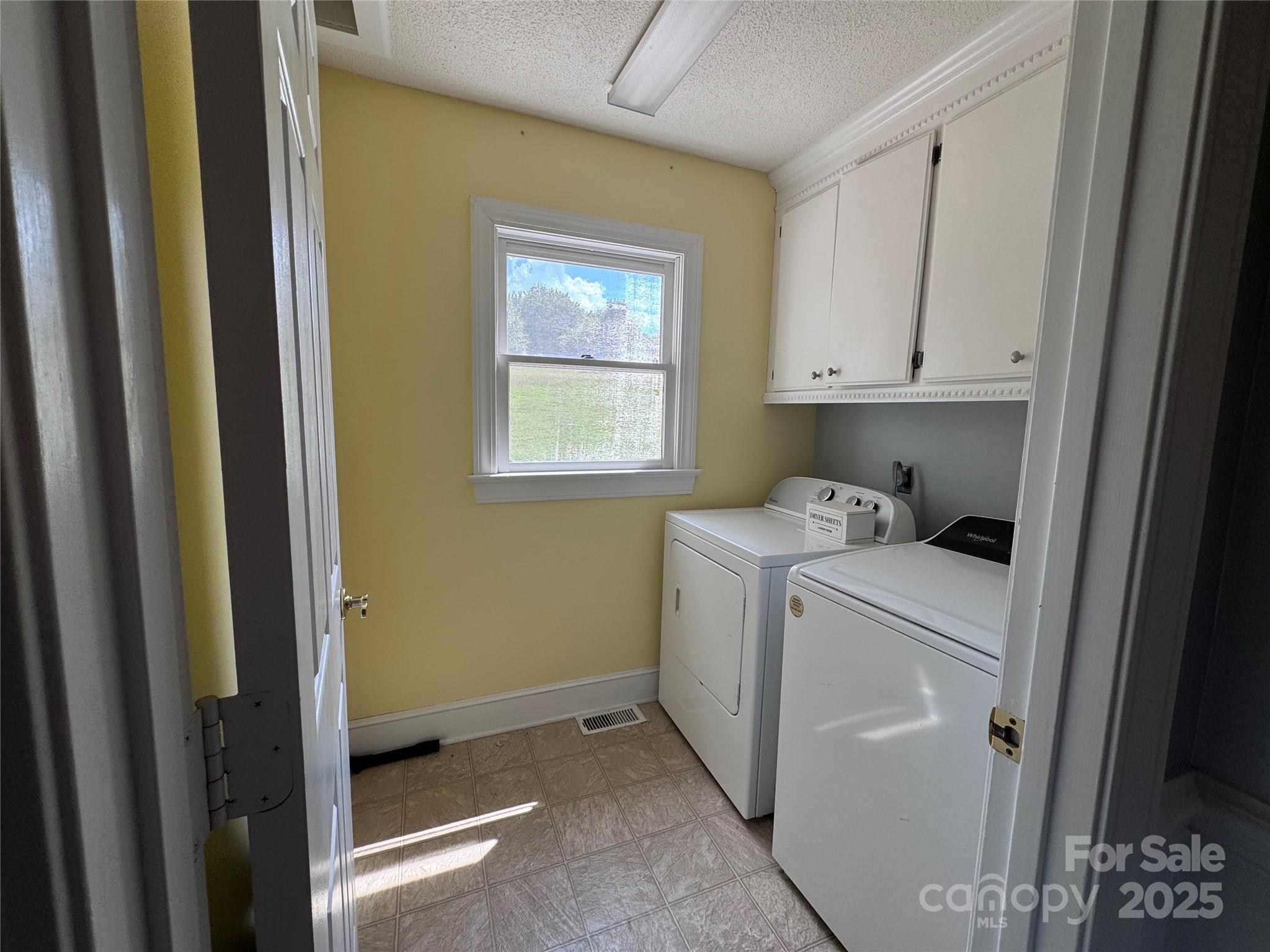 331 Polk Ford Road Stanfield, NC 28163 - Photo 6 of 33 a utility room with dryer and washer