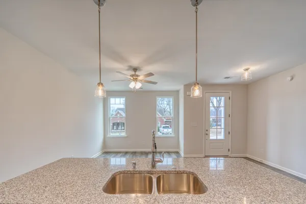 a view of a house with a large tree