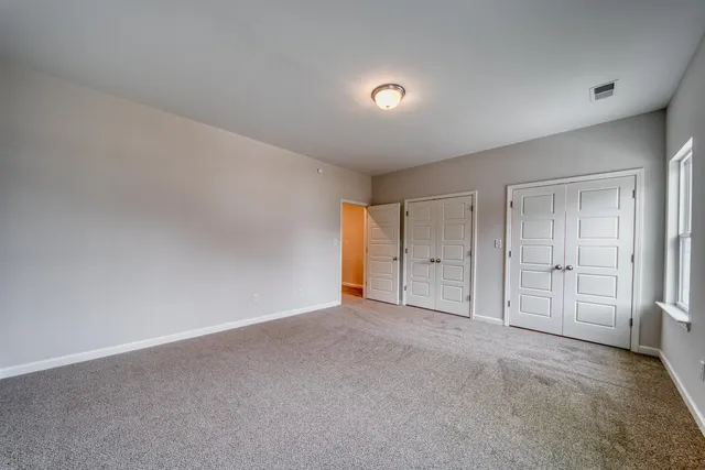 a bathroom with a granite countertop sink a toilet and bathtub
