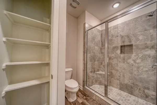 a view of a room with racks on the wall