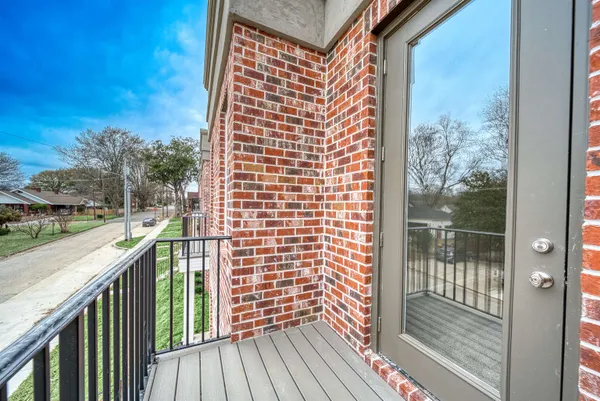 a view of a balcony with wooden floor