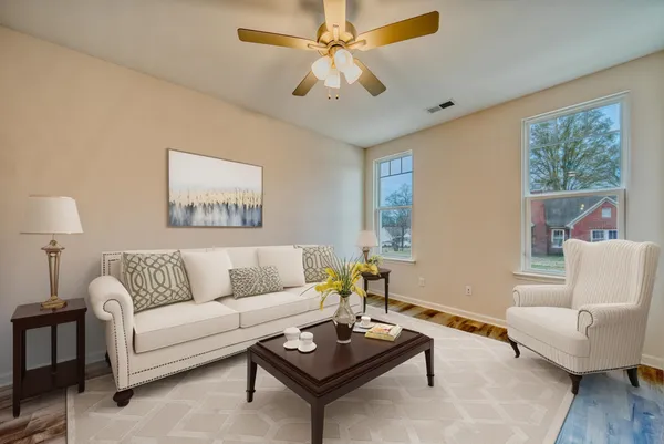 a living room with furniture and a large window