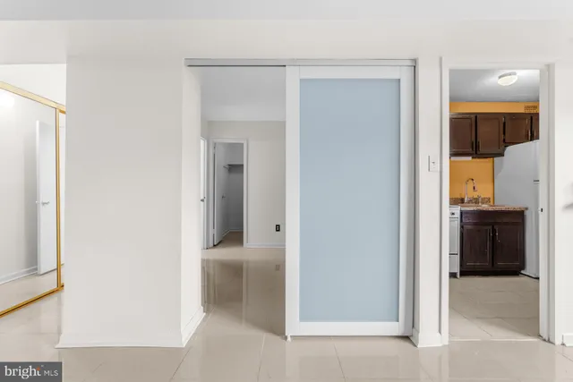 a bedroom with bed and window