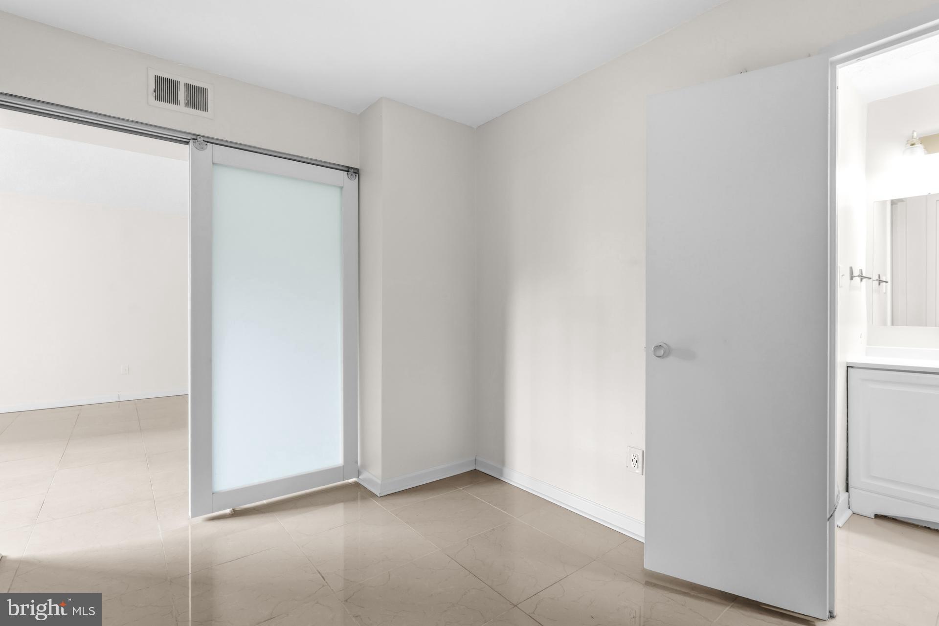 1836 Metzerott Road, Unit 215 Hyattsville, MD 20783 - Photo 19 of 36 a view of an empty room