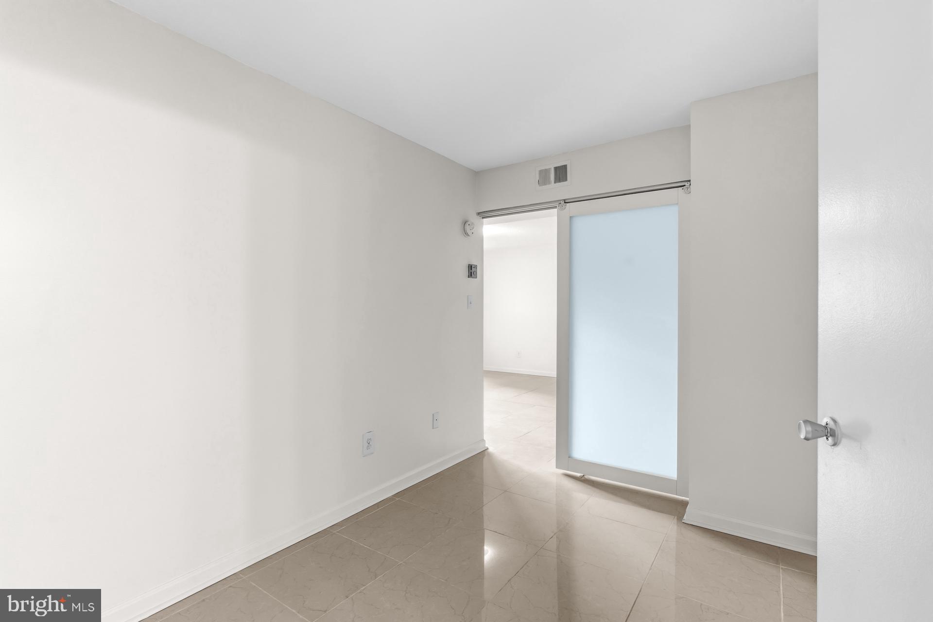 1836 Metzerott Road, Unit 215 Hyattsville, MD 20783 - Photo 20 of 36 a view of an empty room