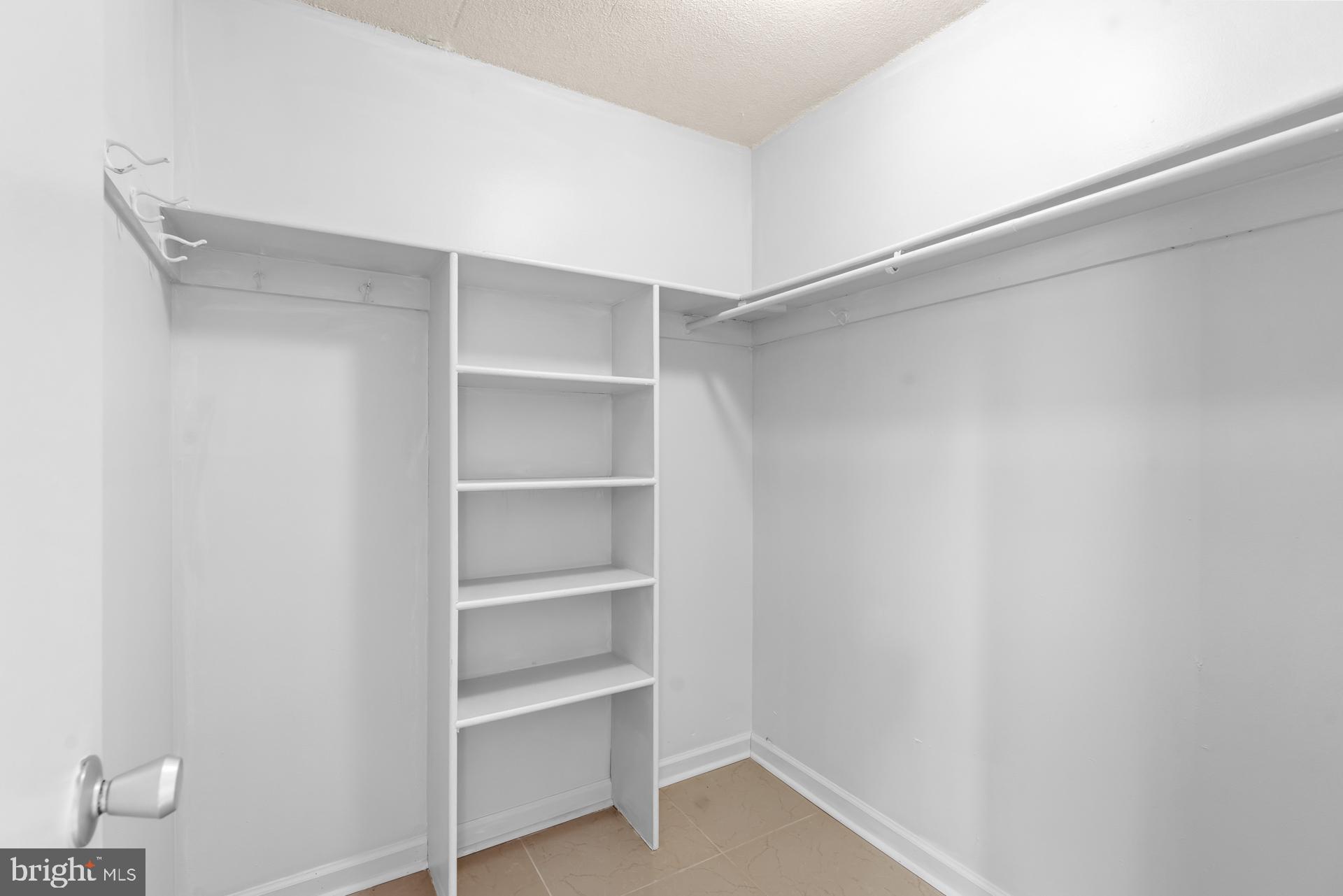 1836 Metzerott Road, Unit 215 Hyattsville, MD 20783 - Photo 21 of 36 a view of an empty walk in closet