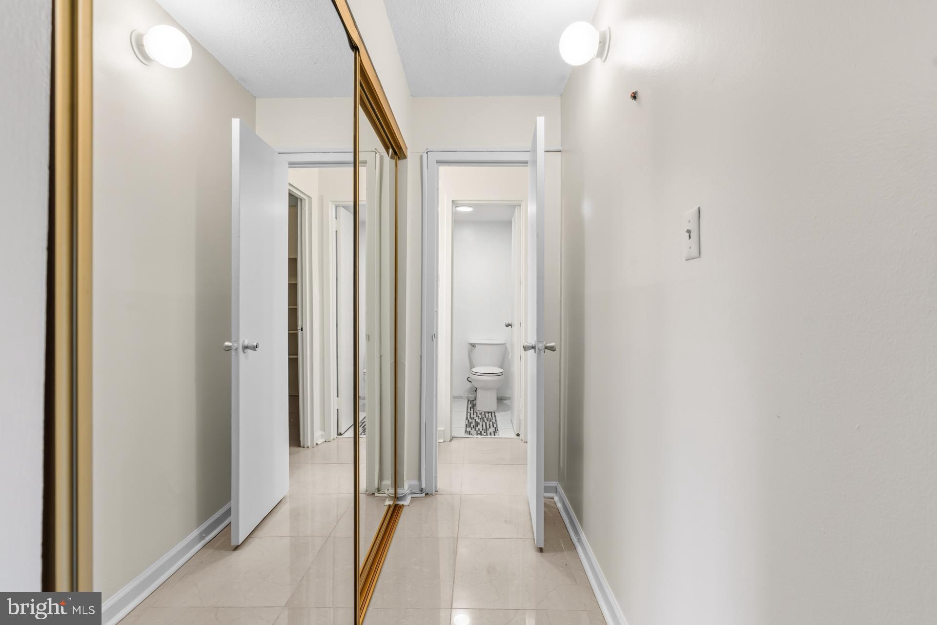 1836 Metzerott Road, Unit 215 Hyattsville, MD 20783 - Photo 27 of 36 a view of a bathroom from a hallway