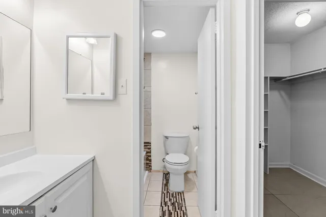 a bathroom with a toilet and shower
