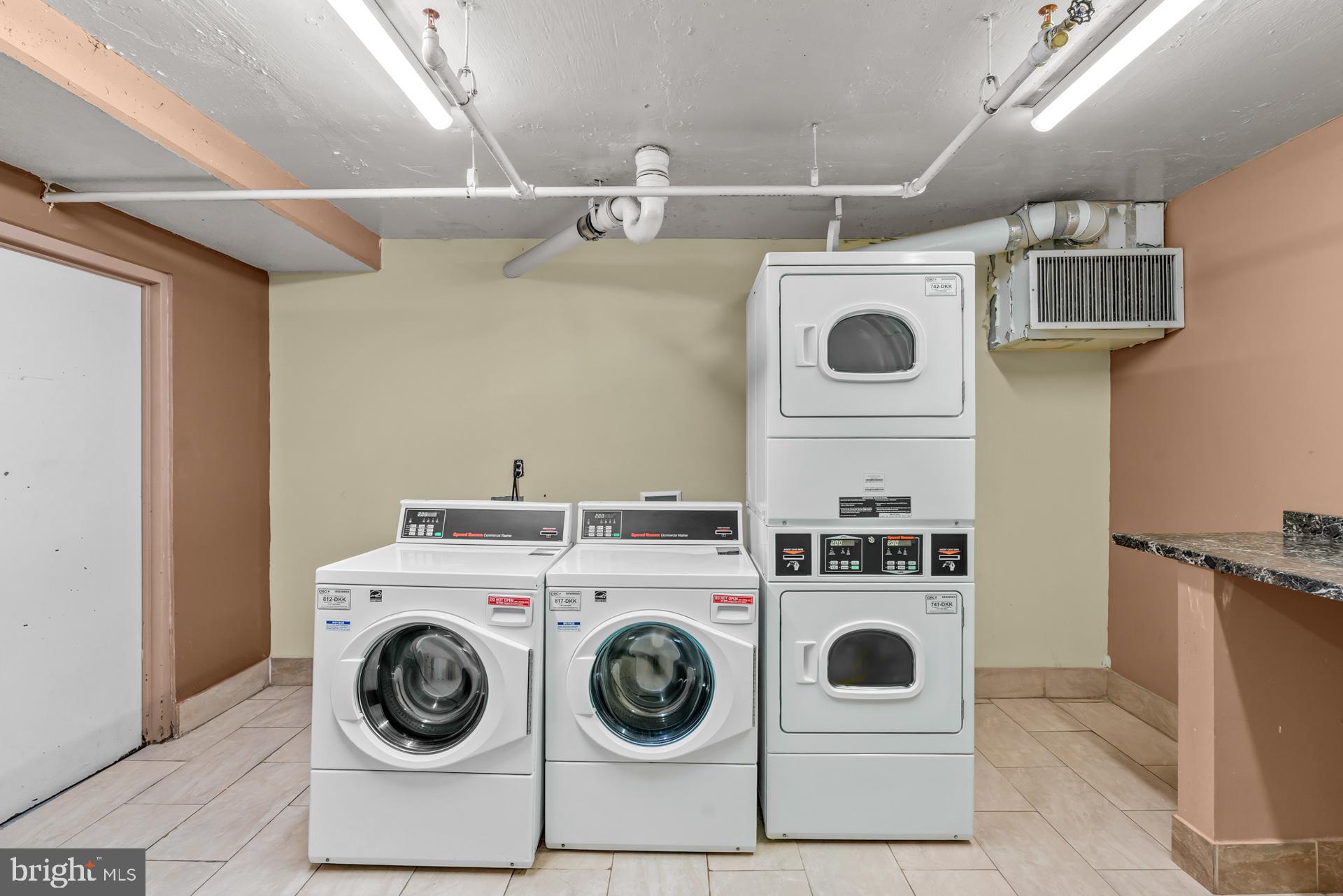 1836 Metzerott Road, Unit 215 Hyattsville, MD 20783 - Photo 31 of 36 a utility room with dryer and washer