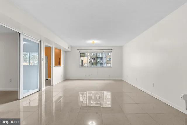 a view of an empty room with a window