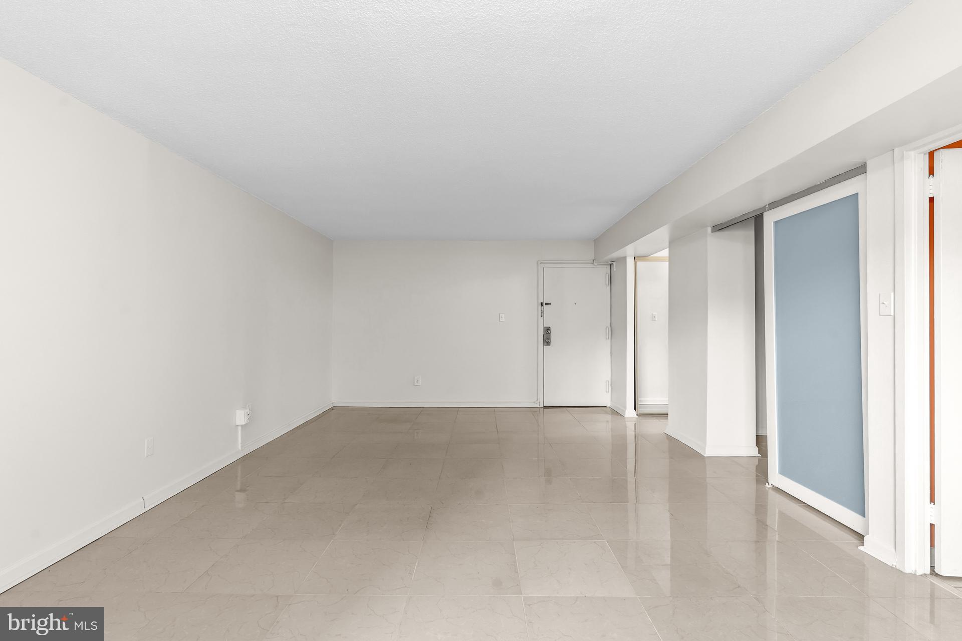 1836 Metzerott Road, Unit 215 Hyattsville, MD 20783 - Photo 7 of 36 a view of an empty room and window