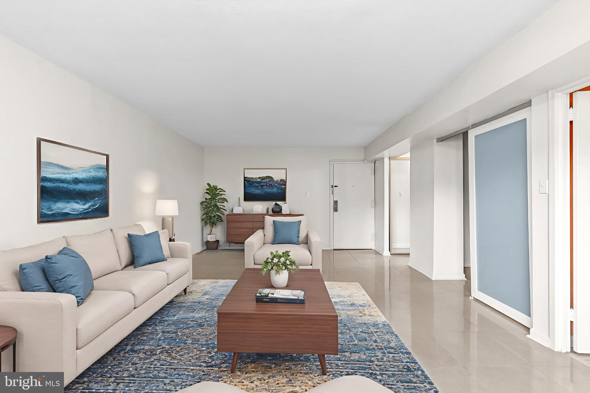 1836 Metzerott Road, Unit 215 Hyattsville, MD 20783 - Photo 8 of 36 a living room with furniture and a rug