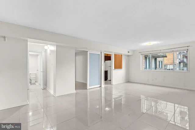 a living room with furniture rug and window