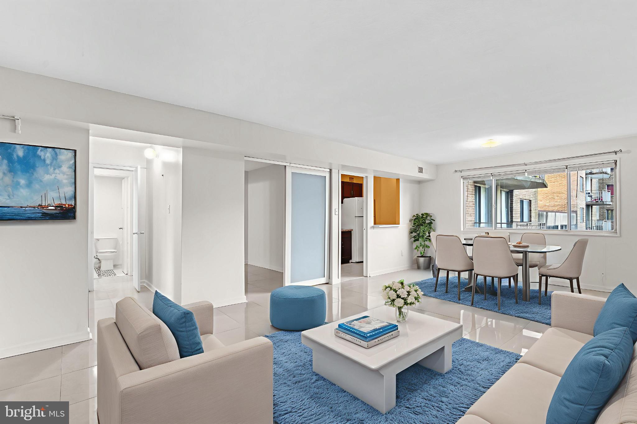 1836 Metzerott Road, Unit 215 Hyattsville, MD 20783 - Photo 10 of 36 a living room with furniture rug and window