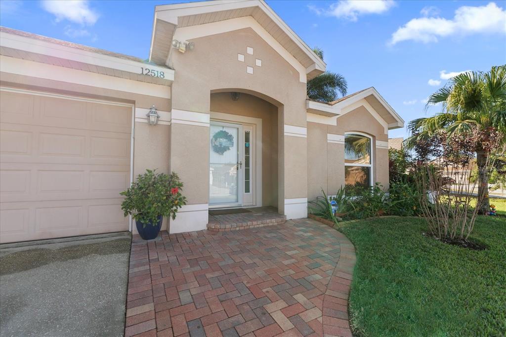 12518 Midpointe Drive Riverview, FL 33578 - Photo 1 of 1 a front view of a house with a garden