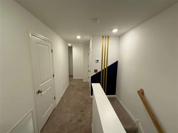 a view of hallway with stairs