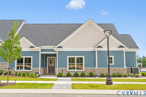 a view of a house with a swimming pool and a yard