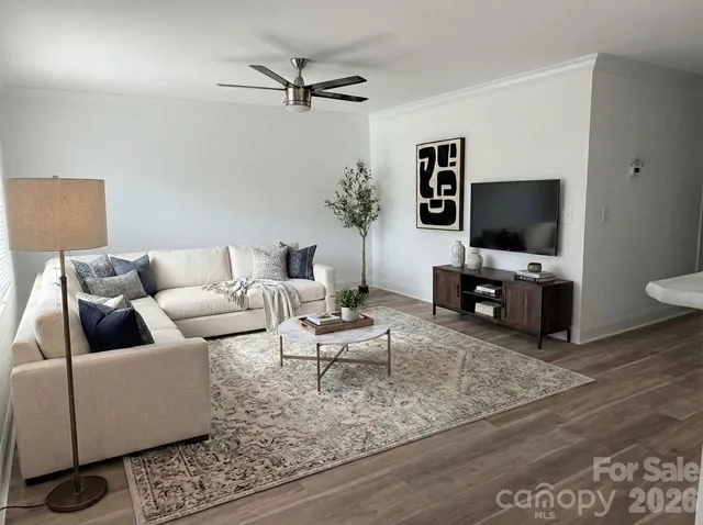 a living room with furniture and a flat screen tv