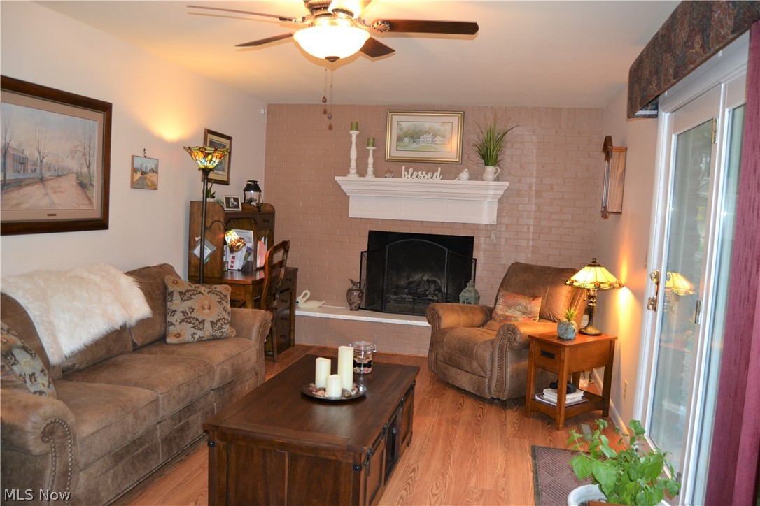 118 Robson Road Marietta, OH 45750 - Photo 4 of 21 The living room offers a cozy fireplace and a wonderful view of the landscaped yard with a brick patio. New laminated wood flooring is throughout the public areas of this home.