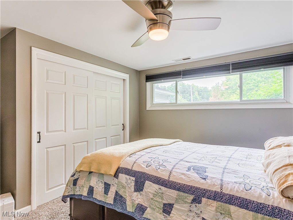 3267 Sandy Lake Road Ravenna, OH 44266 - Photo 16 of 22 Master bedroom with carpet and ceiling fan
