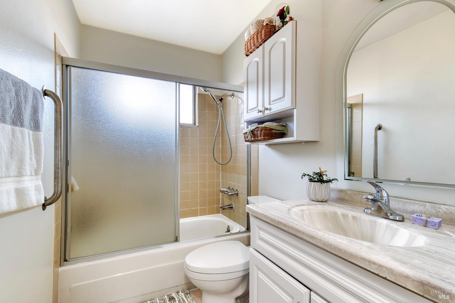 207 Bahia Place San Rafael, CA 94901 - Photo 11 of 21 a bathroom with a granite countertop sink toilet and shower