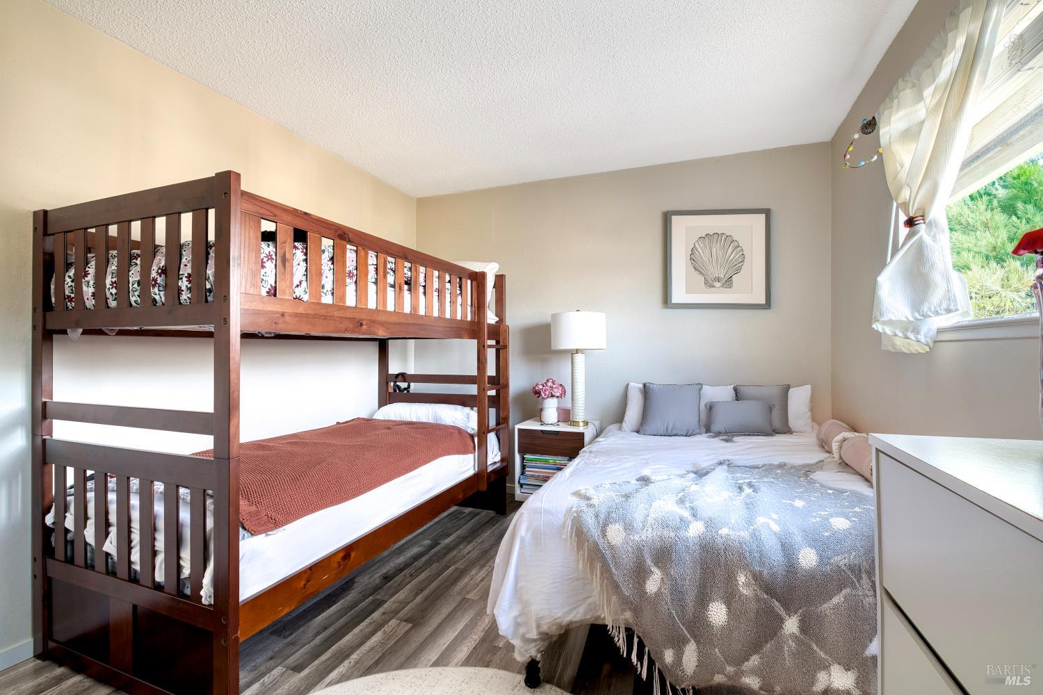 207 Bahia Place San Rafael, CA 94901 - Photo 12 of 21 a bedroom with two beds and window