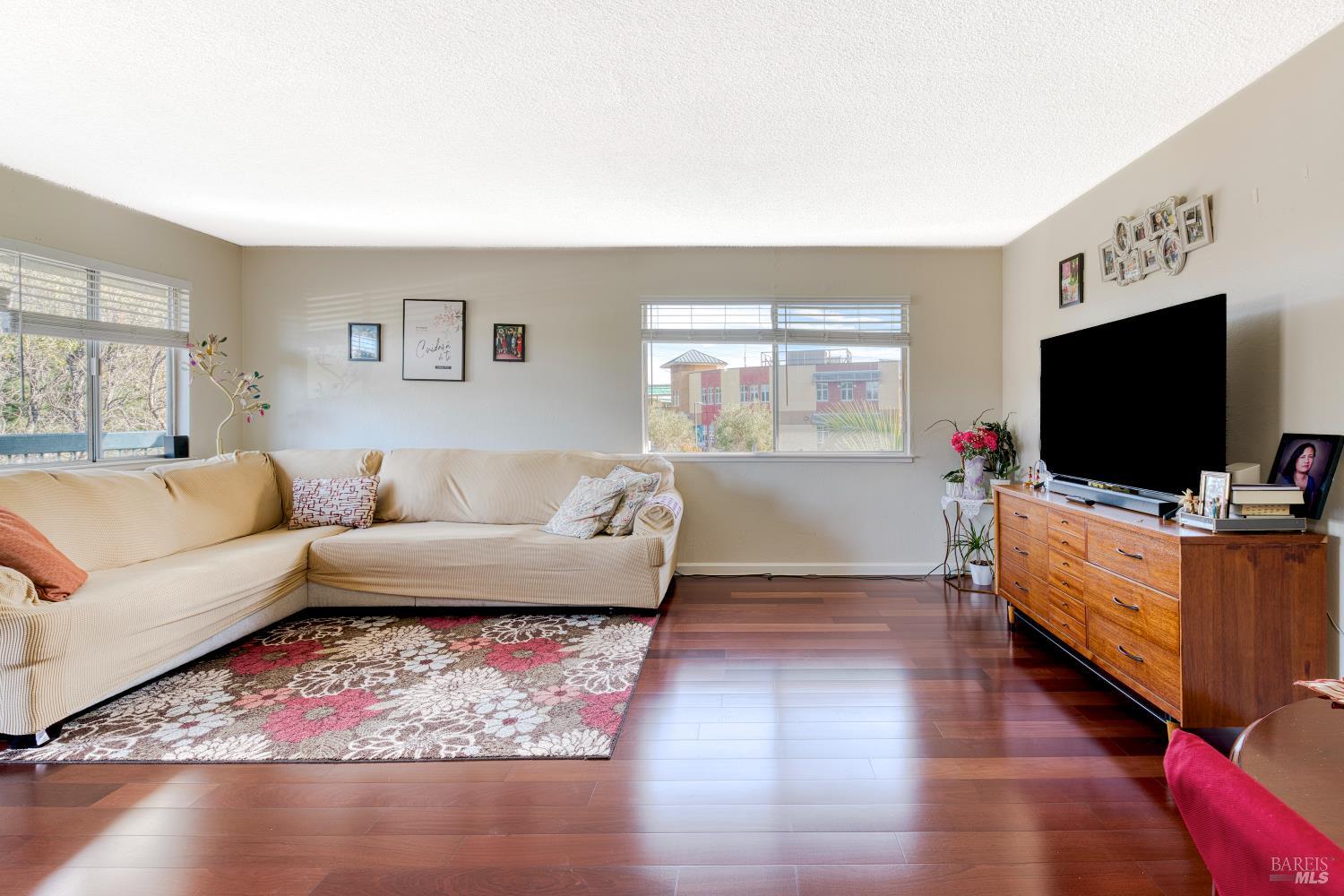 207 Bahia Place San Rafael, CA 94901 - Photo 4 of 21 a living room with furniture and a flat screen tv