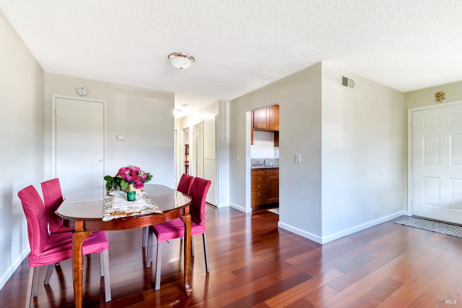 207 Bahia Place San Rafael, CA 94901 - Photo 7 of 21 a view of a dining room with furniture and wooden floor