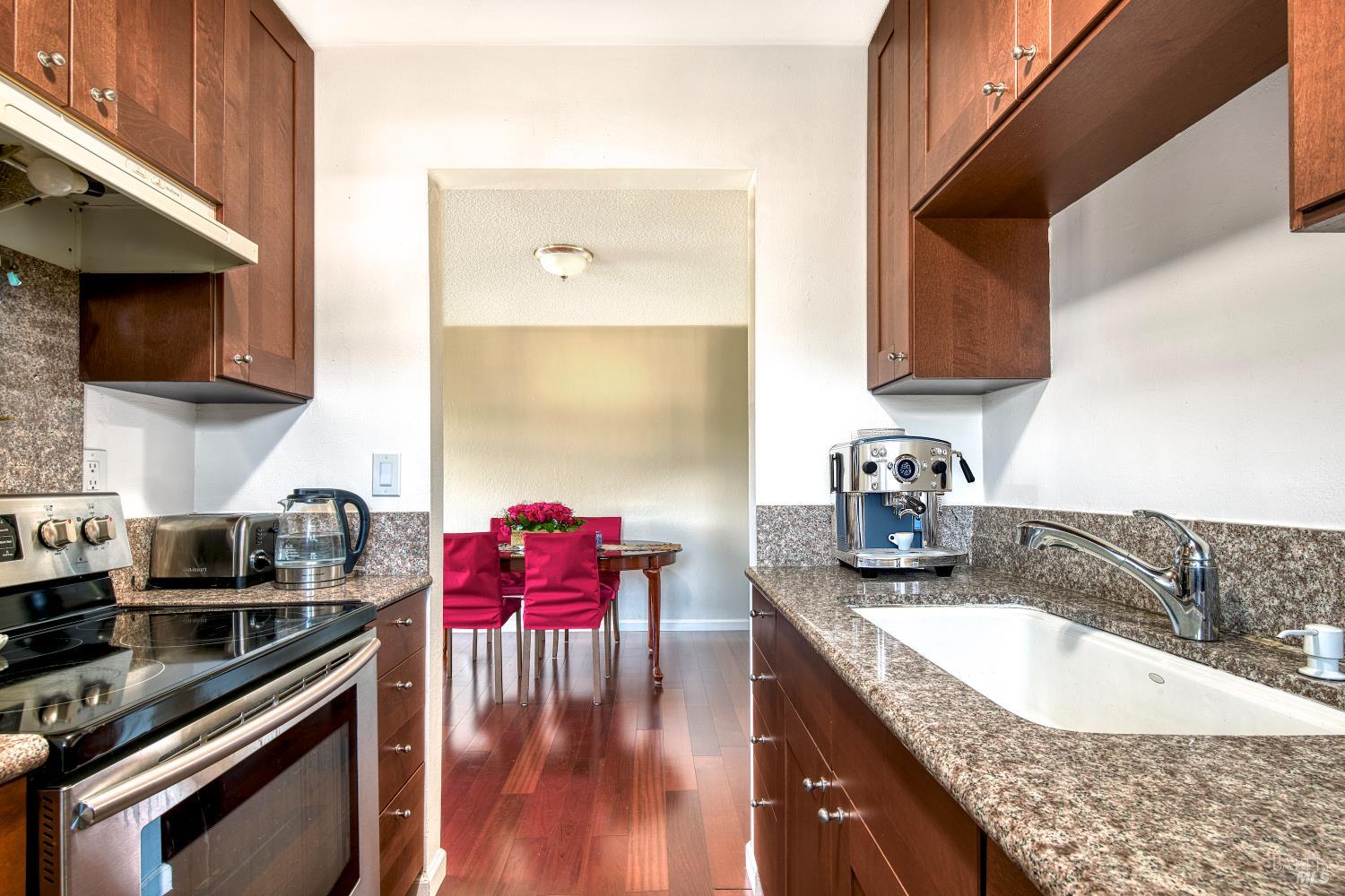 207 Bahia Place San Rafael, CA 94901 - Photo 10 of 21 a kitchen with stainless steel appliances granite countertop a sink stove and cabinets
