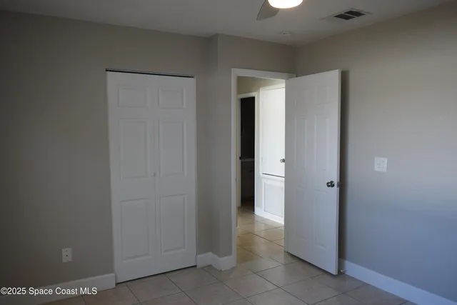 a view of a hallway with closet area