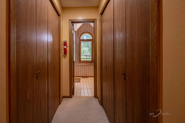 a view of an entryway with wooden floor