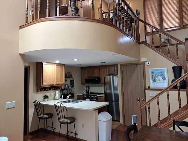 a view of a kitchen with furniture and a window