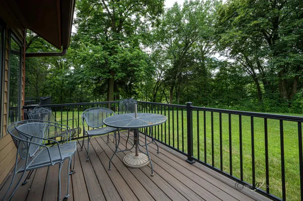 a view of a chairs and table in the patio