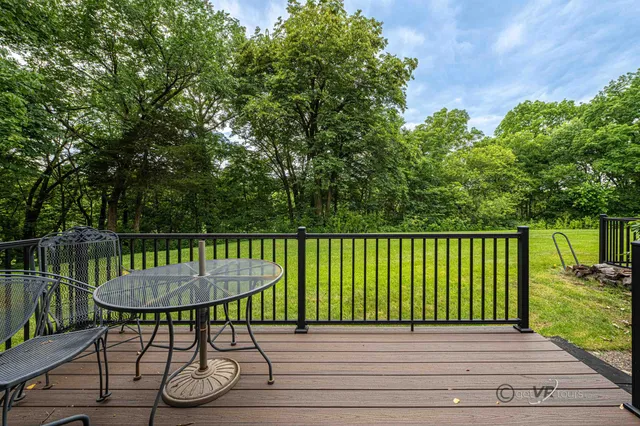 a view of a house with a yard and porch