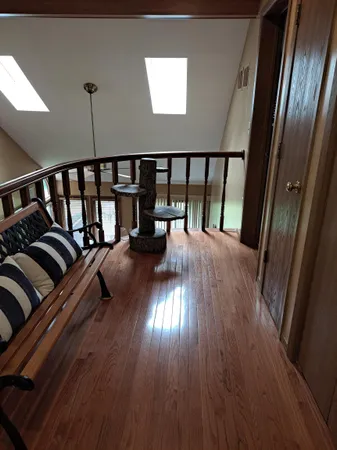 a view of a balcony with furniture